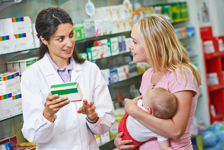 Staff Pharmacist Helping Patient