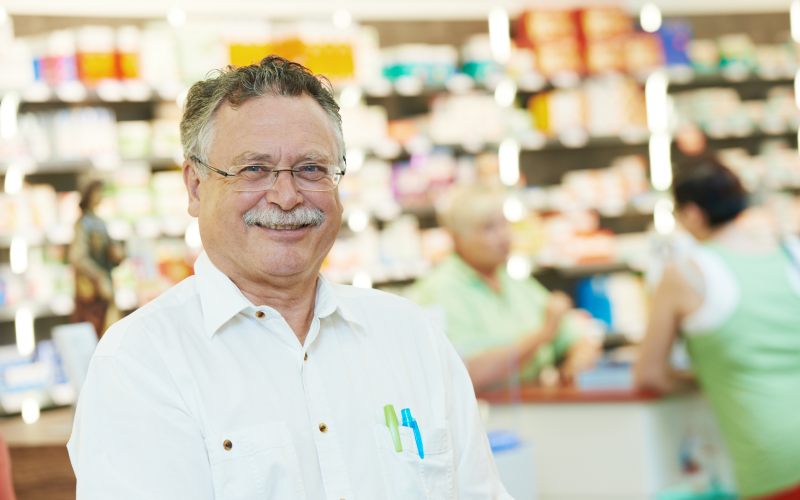 smiling male pharmacist chemist man portrait