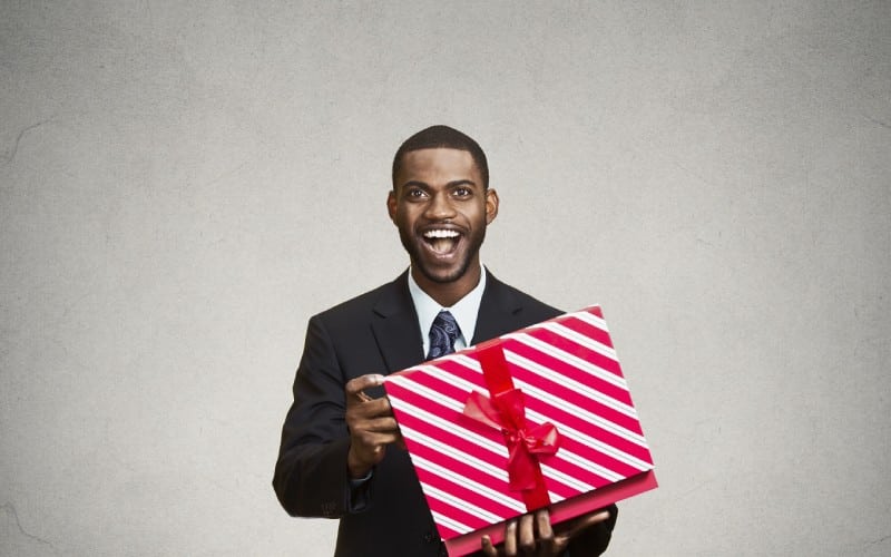 happy-surprised-man-receiving gift from someone