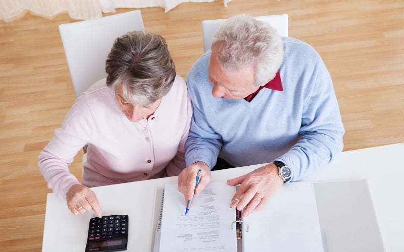 senior couple calculating budget