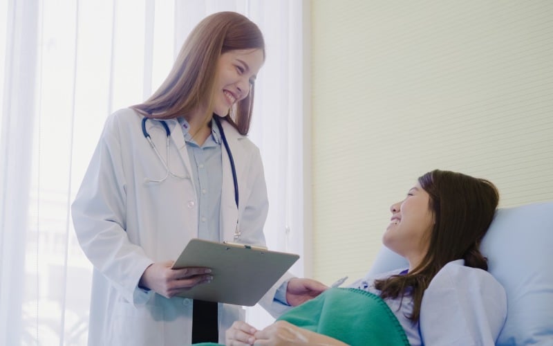 beautiful smart asian doctor-patient-discussing explaining something