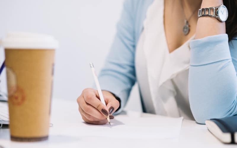 crop woman writing