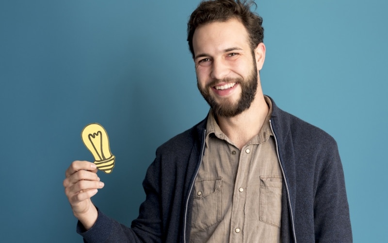 portrait man holding idea light